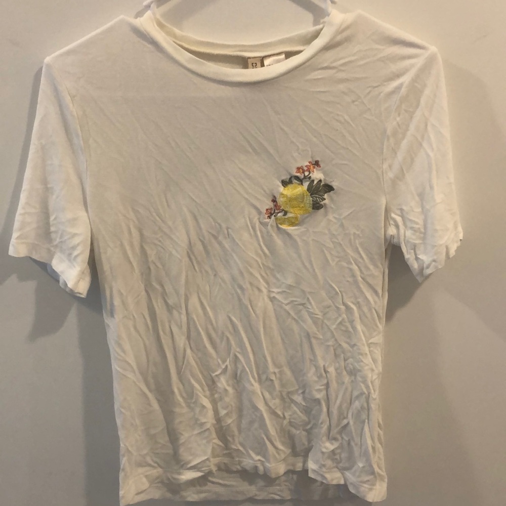 White shirt with lemon and flower detailing